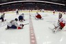 March 6, 2012; Washington, DC, USA; Washington Capitals left wing Matt Hendricks (26) and Carolina Hurricanes goalie Cam Ward (30) stretch on the ice during warm-ups prior to their game at Verizon Center. The Hurricanes won 4-3 in overtime. Mandatory Credit: Geoff Burke-US PRESSWIRE